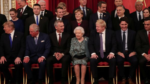 Leaders of NATO alliance countries, and its secretary general Jens Stoltenberg, join Britain's Queen Elizabeth, Prince Charles, Prime Minister Boris Johnson, U.S. President Donald Trump, German Chancellor Angela Merkel, French President Emmanuel Macron and Canadian Prime Minister Justin Trudeau for a group picture as they gather for to mark 70 years of NATO Alliance during a reception at Buckingham Palace, London, Britain December 3, 2019. - Sputnik International