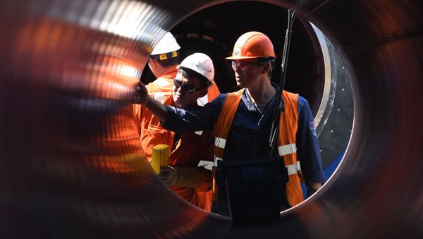 Employees work at the construction site of the Nord Stream 2 pipeline outside the town of Kingisepp, Leningrad region, Russia - Sputnik International