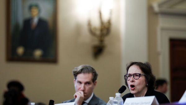 Pamela Karlan, co-director of the Supreme Court Litigation Clinic at Stanford University Law School, testifies as fellow witness Noah Feldman, a professor of law at Harvard University Law School, listens at the start of a House Judiciary Committee hearing on the impeachment inquiry - Sputnik International