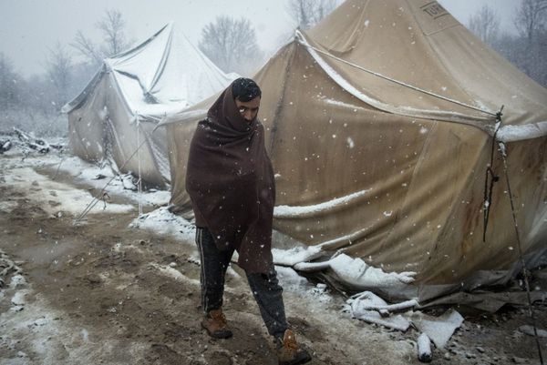 A migrant walks amid tents during snowfall at the Vucjak refugee camp outside Bihac, northwestern Bosnia, Monday, Dec. 2, 2019. A migrant walks amid tents during snowfall at the Vucjak refugee camp outside Bihac, northwestern Bosnia, Monday, Dec. 2, 2019. - Sputnik International