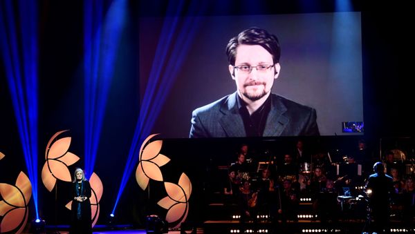 Former Right Livelihood laureate Edward Snowden speaks from a video screen during the 2019 Right Livelihood Award ceremony at Cirkus, Stockholm, Sweden 4 December 2019 Former Right Livelihood laureate Edward Snowden speaks from a video screen during the 2019 Right Livelihood Award ceremony at Cirkus, Stockholm, Sweden 4 December 2019 - Sputnik International