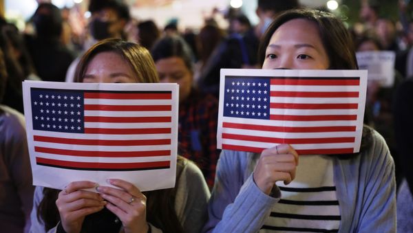 Protester holds U.S. flags during a demonstration in Hong Kong, Thursday, Nov. 28, 2019 Protester holds U.S. flags during a demonstration in Hong Kong, Thursday, Nov. 28, 2019 - Sputnik International