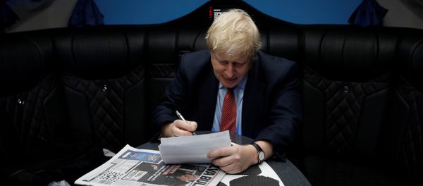 Britain's Prime Minister Boris Johnson works inside his campaign bus in Kent, Britain, December 6, 2019. Britain's Prime Minister Boris Johnson works inside his campaign bus in Kent, Britain, December 6, 2019. - Sputnik International