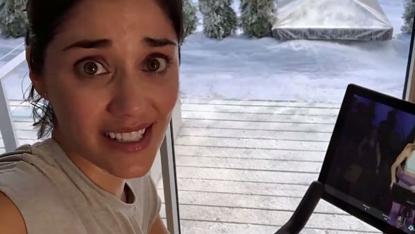 An actor is pictured in this screengrab from The Gift That Gives Back exercise bike commercial by Peloton - Sputnik International
