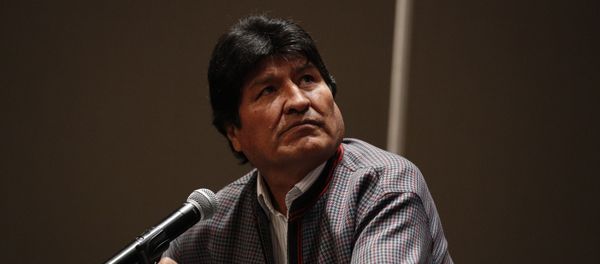 Former Bolivian President Evo Morales, who was granted asylum in Mexico, looks up toward a video playing on a screen during a press conference in Mexico City, Wednesday, Nov. 20, 2019. Former Bolivian President Evo Morales, who was granted asylum in Mexico, looks up toward a video playing on a screen during a press conference in Mexico City, Wednesday, Nov. 20, 2019. - Sputnik International
