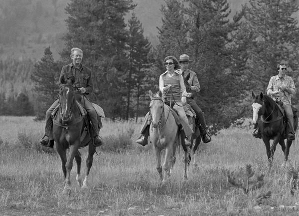 President Jimmy Carter and his wife, Rosalynn, guide their horses towards the corral after a day of horseback riding near Jenny Lake in Wyoming, Aug. 30, 1978 President Jimmy Carter and his wife, Rosalynn, guide their horses towards the corral after a day of horseback riding near Jenny Lake in Wyoming, Aug. 30, 1978 - Sputnik International