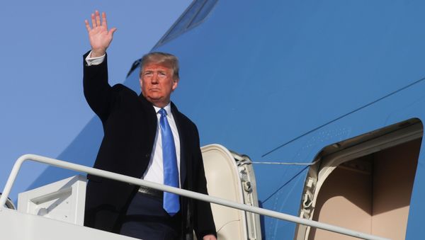 U.S. President Donald Trump waves as he boards Air Force One to depart Washington for a day and evening trip to Florida from Joint Base Andrews, Maryland, U.S., December 7, 2019. - Sputnik International