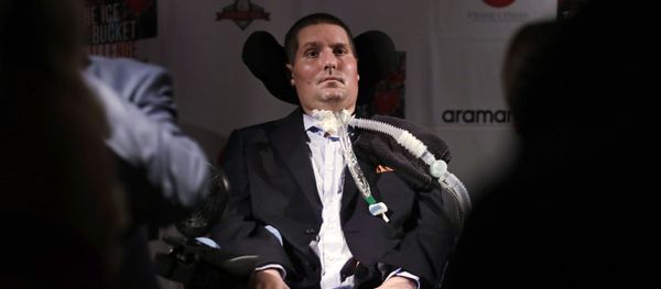 --FILE-- In this Sept. 18, 2017 photograph, Pete Frates, who is stricken with amyotrophic lateral sclerosis, or ALS, and is the inspiration of the Ice Bucket Challenge, listens to a guest at Fenway Park in Boston. --FILE-- In this Sept. 18, 2017 photograph, Pete Frates, who is stricken with amyotrophic lateral sclerosis, or ALS, and is the inspiration of the Ice Bucket Challenge, listens to a guest at Fenway Park in Boston. - Sputnik International
