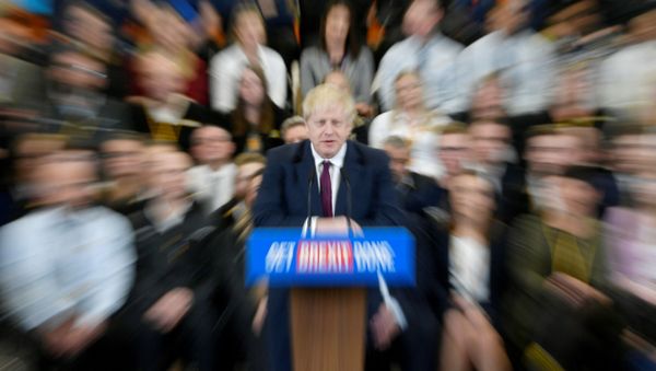 Britain's Prime Minister Boris Johnson speaks to the workers as he visits a JCB factory during his general election campaign in Uttoxeter, Britain, December 10, 2019. Picture taken with a zoom burst. REUTERS/Toby Melville Britain's Prime Minister Boris Johnson speaks to the workers as he visits a JCB factory during his general election campaign in Uttoxeter, Britain, December 10, 2019. Picture taken with a zoom burst. REUTERS/Toby Melville - Sputnik International