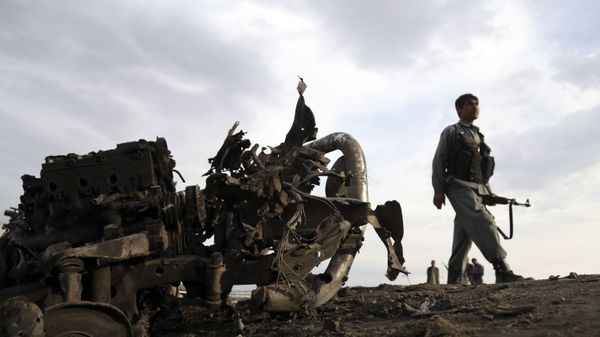 Afghan security forces gather at the site of an attack near the Bagram Air Base, north of Kabul, Afghanistan, Tuesday, April 9, 2019. Three American service members and a U.S. contractor were killed when their convoy hit a roadside bomb near the main US base in Afghanistan. - Sputnik International