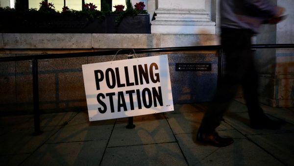 A man walks past a sign outside a polling station on general election day in London, Britain, December 12, 2019 A man walks past a sign outside a polling station on general election day in London, Britain, December 12, 2019 - Sputnik International