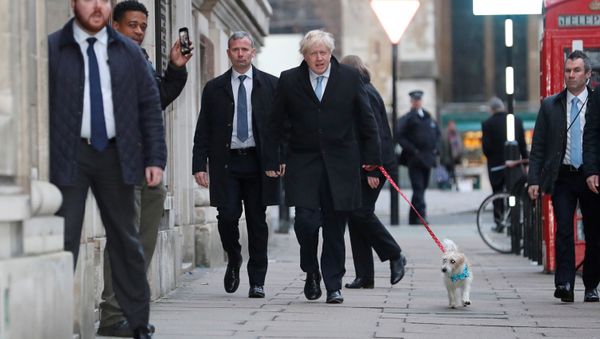Britain's Prime Minister Boris Johnson arrives with his dog Dilyn at a polling station at the Methodist Central Hall to vote in the general election in London, Britain, December 12, 2019 Britain's Prime Minister Boris Johnson arrives with his dog Dilyn at a polling station at the Methodist Central Hall to vote in the general election in London, Britain, December 12, 2019 - Sputnik International
