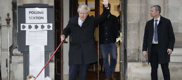 Britain's Prime Minister and Conservative Party leader Boris Johnson with his dog Dilyn leaves after voting in the general election at Methodist Central Hall, Westminster, London, Thursday, Dec. 12, 2019. Britain's Prime Minister and Conservative Party leader Boris Johnson with his dog Dilyn leaves after voting in the general election at Methodist Central Hall, Westminster, London, Thursday, Dec. 12, 2019. - Sputnik International