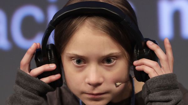 Climate activist Greta Thunberg adjusts the headphones during a press conference in Madrid, Friday Dec. 6, 2019 - Sputnik International