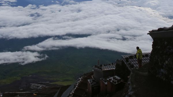A climber views a landscape from Mount Fuji in Fujiyoshida city, Yamanashi prefecture, Japan, Thursday, July 4, 2013. Japan's most iconic landmark, Mount Fuji, the 3,776-meter-tall mountain was selected as a World Heritage site in June.  - Sputnik International