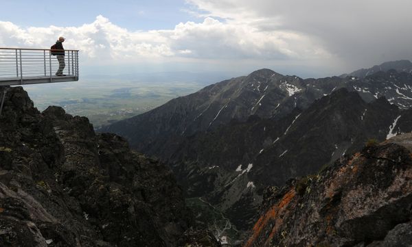 A man takes in the view from the peak of Lomnicky Stit, the home of an observatory, in the High Tatras mountains on 2 July 2009 A man takes in the view from the peak of Lomnicky Stit, the home of an observatory, in the High Tatras mountains on 2 July 2009 - Sputnik International