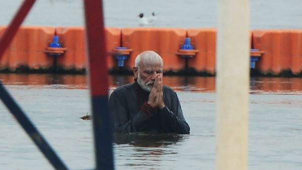 Indian Prime Minister Narendra Modi takes a holy dip at Sangam, the confluence of the rivers Ganges and Yamuna and mythical Saraswati, during the Kumbh Mela festival in Allahabad on February 24, 2019.  - Sputnik International