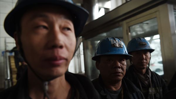 In this photo taken on November 19, 2015, coal miners wait to enter a mine at Datong, in China's northern Shanxi province. - Sputnik International
