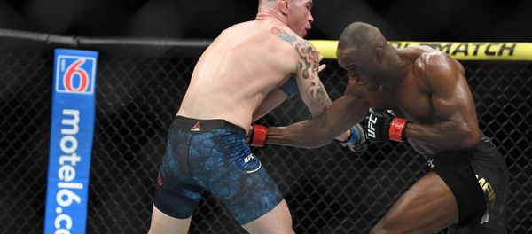 Kamaru Usman (red gloves) fights Colby Covington (blue gloves) during UFC 245 at T-Mobile Arena in Las Vegas. Kamaru Usman (red gloves) fights Colby Covington (blue gloves) during UFC 245 at T-Mobile Arena in Las Vegas. - Sputnik International