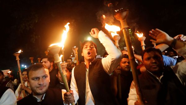 Members of the youth wing of India's main opposition Congress party shout slogans during a protest against the Citizenship Amendment Bill, a bill that seeks to give citizenship to religious minorities persecuted in neighbouring Muslim countries, in New Delhi, India December 11, 2019 - Sputnik International
