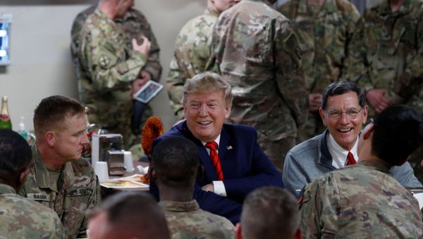 U.S. President Donald Trump eats dinner with U.S. troops at a Thanksgiving dinner event during a surprise visit at Bagram Air Base in Afghanistan, November 28, 2019 - Sputnik International