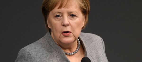 Chancellor Angela Merkel attends a session of Germany's lower house of parliament, the Bundestag, in Berlin, 18 December 2019 Chancellor Angela Merkel attends a session of Germany's lower house of parliament, the Bundestag, in Berlin, 18 December 2019 - Sputnik International