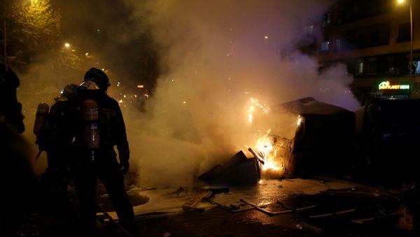 FC Barcelona v Real Madrid - Barcelona, Spain - December 18, 2019  Firefighters respond to a fire as protestors gather in Barcelona during the football match between FC Barcelona and Real Madrid  - Sputnik International