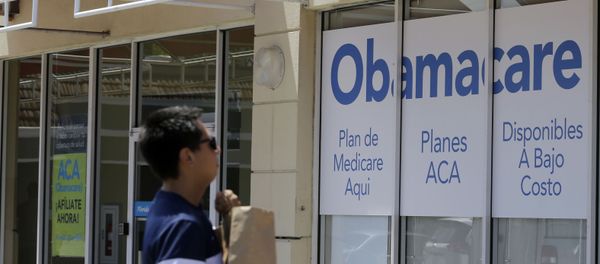 A man walks by a healthcare insurance office in Hialeah, Fla. A man walks by a healthcare insurance office in Hialeah, Fla. - Sputnik International