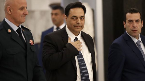 Newly-assigned Lebanese Prime Minister, Hassan Diab, center, greets journalists upon his arrival to meet with Lebanese President Michel Aoun at the presidential palace, in Baabda, east of Beirut, Lebanon, Thursday, Dec. 19, 2019. - Sputnik International