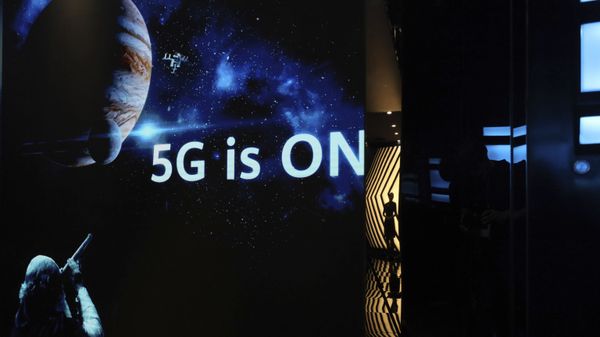 In this Aug. 19, 2019, photo, a guide is silhouetted in an exhibition promoting Huawei's 5G technologies at the Huawei Campus in Shenzhen in Southern China's Guangdong province In this Aug. 19, 2019, photo, a guide is silhouetted in an exhibition promoting Huawei's 5G technologies at the Huawei Campus in Shenzhen in Southern China's Guangdong province - Sputnik International