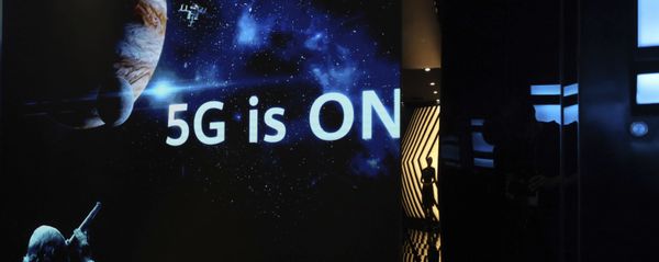 In this Aug. 19, 2019, photo, a guide is silhouetted in an exhibition promoting Huawei's 5G technologies at the Huawei Campus in Shenzhen in Southern China's Guangdong province In this Aug. 19, 2019, photo, a guide is silhouetted in an exhibition promoting Huawei's 5G technologies at the Huawei Campus in Shenzhen in Southern China's Guangdong province - Sputnik International