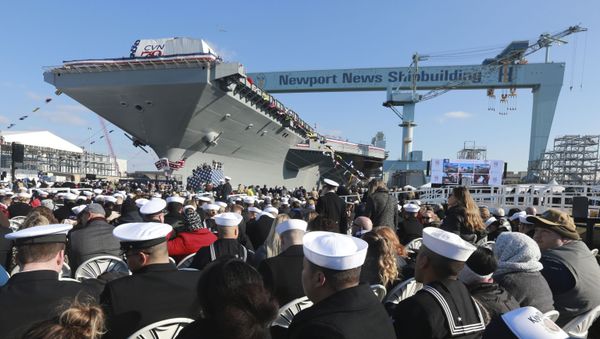 Spectators take their seats as they wait for ceremonies to begin for the christening of the nuclear aircraft carrier John F. Kennedy at Newport News Shipbuilding in Newport News, Va., Saturday, Dec. 7, 2019. (AP Photo/Steve Helber) - Sputnik International