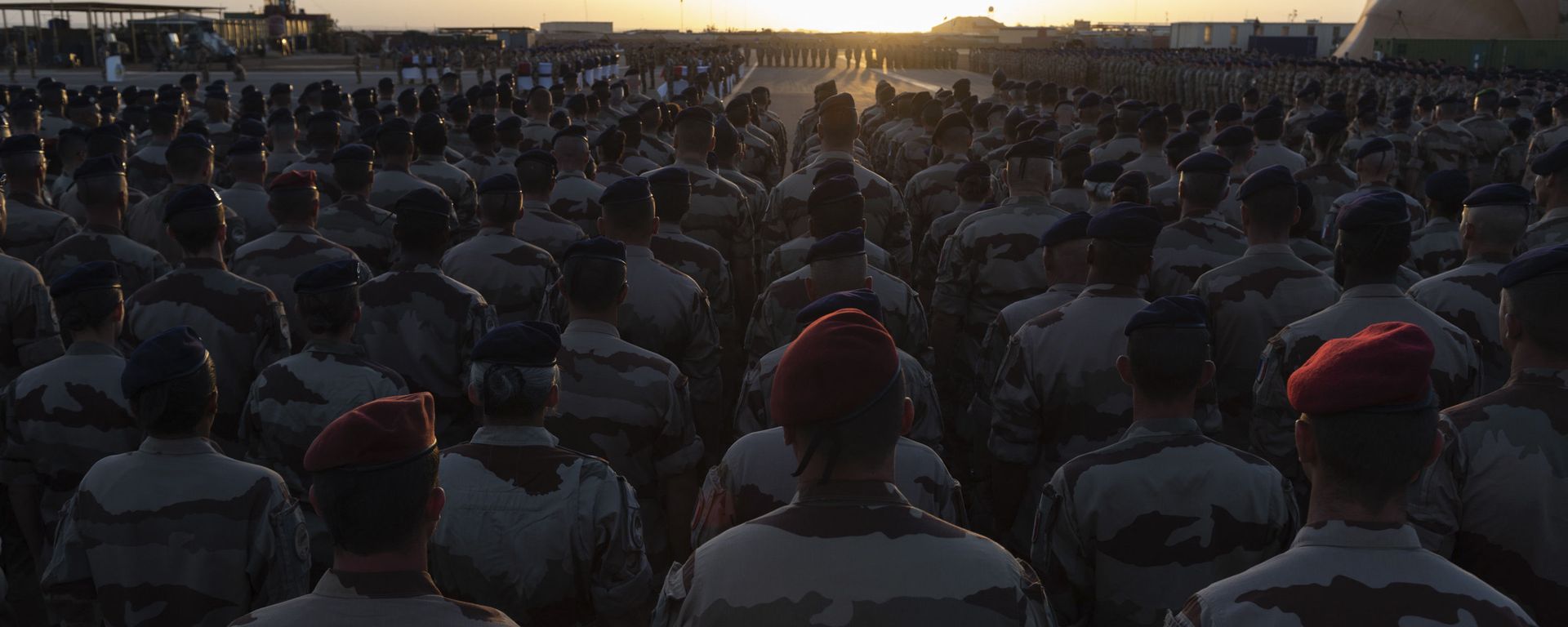 In this Saturday, Nov. 30, 2019 photo provided by French Defense Communication and Audiovisual Department (ECPAD), French soldiers attend a ceremony before loading the coffins of the 13 French soldiers into a military plane, in Gao, Mali. France will pay Monday a national homage for the 13 French soldiers killed inan helicopter collision while fighting Islamic State group-linked extremists In this Saturday, Nov. 30, 2019 photo provided by French Defense Communication and Audiovisual Department (ECPAD), French soldiers attend a ceremony before loading the coffins of the 13 French soldiers into a military plane, in Gao, Mali. France will pay Monday a national homage for the 13 French soldiers killed inan helicopter collision while fighting Islamic State group-linked extremists - Sputnik International, 1920, 20.05.2021
