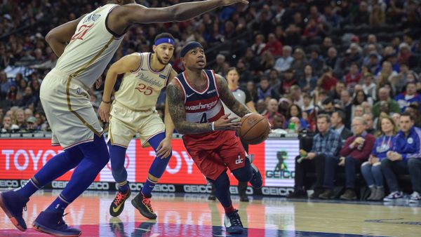Washington Wizards guard Isaiah Thomas (4) drives to the basket as Philadelphia 76ers center Joel Embiid (21) defends during the first quarter of the game - Sputnik International