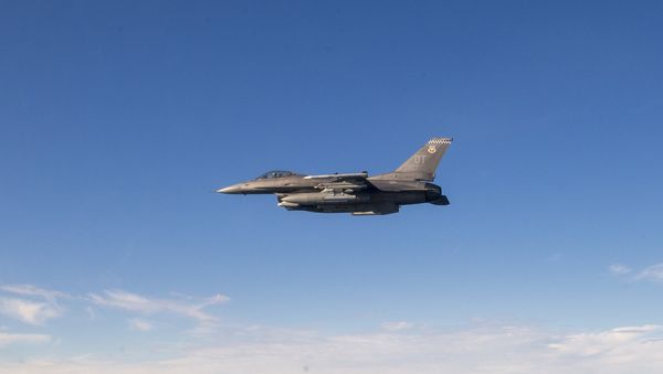 A F-16C flown by Maj Jeffrey Entine,  85th Flight Test Squadron test pilot, prepares to fire a rocket at a test drone at Eglin Air Force Base, Fla., Dec. 19, 2019 - Sputnik International