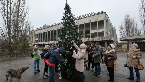 Former residents of Pripyat located near the Chernobyl Nuclear Power Plant decorate a Christmas tree, which was installed in the main square of the ghost town for the first time since 1985, in Pripyat, Ukraine December 25, 2019 Former residents of Pripyat located near the Chernobyl Nuclear Power Plant decorate a Christmas tree, which was installed in the main square of the ghost town for the first time since 1985, in Pripyat, Ukraine December 25, 2019 - Sputnik International
