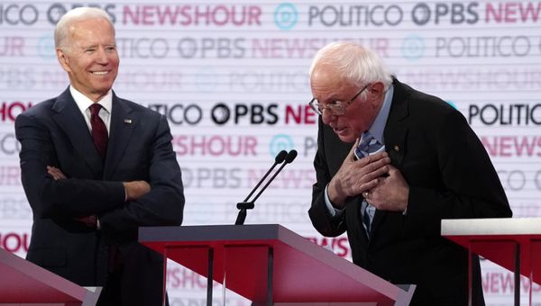 Former Vice President Joe Biden watches and listens to Senator Bernie Sanders speak towards the end of the sixth 2020 U.S. Democratic presidential candidates campaign debate at Loyola Marymount University in Los Angeles, California, U.S., December 19, 2019.  - Sputnik International