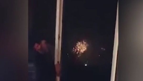 A man, allegedly in Russia, was caught on tape imitating sounds similar to those made by exploding fireworks using only his mouth and a plastic bowl. - Sputnik International