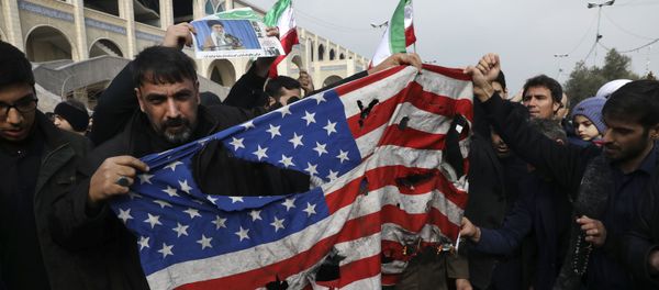 Protesters burn a U.S. flag during a demonstration over the U.S. airstrike in Iraq that killed Iranian Revolutionary Guard Gen. Qassem Soleimani, in Tehran, Iran, Jan. 3, 2020 Protesters burn a U.S. flag during a demonstration over the U.S. airstrike in Iraq that killed Iranian Revolutionary Guard Gen. Qassem Soleimani, in Tehran, Iran, Jan. 3, 2020 - Sputnik International