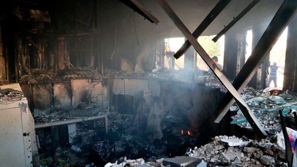 Smoke rises from the reception room of the U.S. embassy that was burned by Pro-Iranian militiamen and their supporters, in Baghdad, Iraq, Jan. 1, 2020.  - Sputnik International