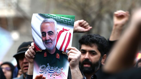 Iranian demonstrators chant slogans during a protest against the assassination of the Iranian Major-General Qassem Soleimani, head of the elite Quds Force, and Iraqi militia commander Abu Mahdi al-Muhandis, who were killed in an air strike at Baghdad airport, in front of United Nation office in Tehran, Iran January 3, 2020. Iranian demonstrators chant slogans during a protest against the assassination of the Iranian Major-General Qassem Soleimani, head of the elite Quds Force, and Iraqi militia commander Abu Mahdi al-Muhandis, who were killed in an air strike at Baghdad airport, in front of United Nation office in Tehran, Iran January 3, 2020. - Sputnik International