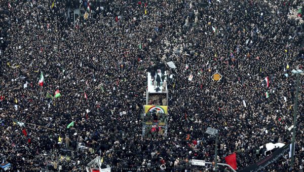 Coffins of Gen. Qassem Soleimani and others who were killed in Iraq by a U.S. drone strike, are carried on a truck surrounded by mourners - Sputnik International