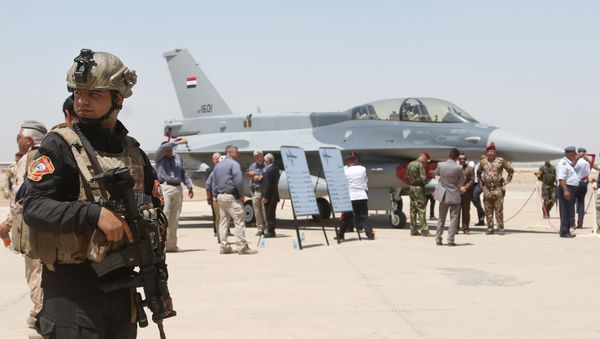 raqi SWAT team stands guard as security forces and others gather next to a U.S.- made F-16 fighter jet during the delivery ceremony at Balad air base - Sputnik International