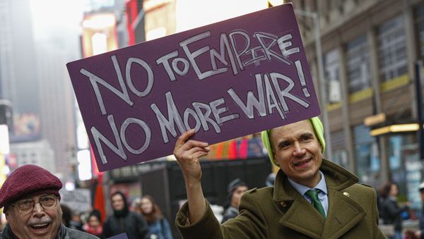 A man joins the anti-war protest at Times Square in New York on January 4, 2020. - Demonstrators are protesting the US drone attack which killed Iran's Major General Qasem Soleimani in Iraq on January 3, a dramatic escalation in spiralling tensions between Iran and the US, which pledged to send thousands more troops to the region. A man joins the anti-war protest at Times Square in New York on January 4, 2020. - Demonstrators are protesting the US drone attack which killed Iran's Major General Qasem Soleimani in Iraq on January 3, a dramatic escalation in spiralling tensions between Iran and the US, which pledged to send thousands more troops to the region. - Sputnik International