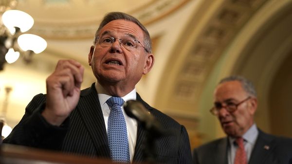 U.S. Sen. Bob Menendez speaks as Senate Minority Leader Sen. Chuck Schumer listens during a news briefing - Sputnik International