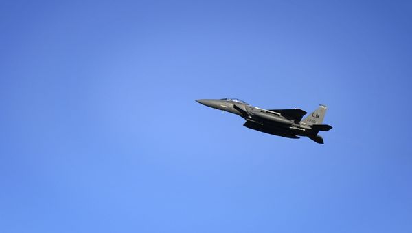 In this image released by the US Air Force (USAF), an F-15E Strike Eagle departs RAF Lakenheath in the United Kingdom. - Sputnik International