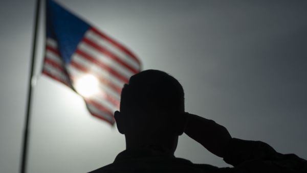 This US Air Force file photo obtained January 5, 2020 shows US Air Force Staff Sgt. Devin Boyer, 435th Air Expeditionary Wing photojournalist, as he salutes the flag at Camp Simba, Kenya, on August 26, 2019. This US Air Force file photo obtained January 5, 2020 shows US Air Force Staff Sgt. Devin Boyer, 435th Air Expeditionary Wing photojournalist, as he salutes the flag at Camp Simba, Kenya, on August 26, 2019. - Sputnik International