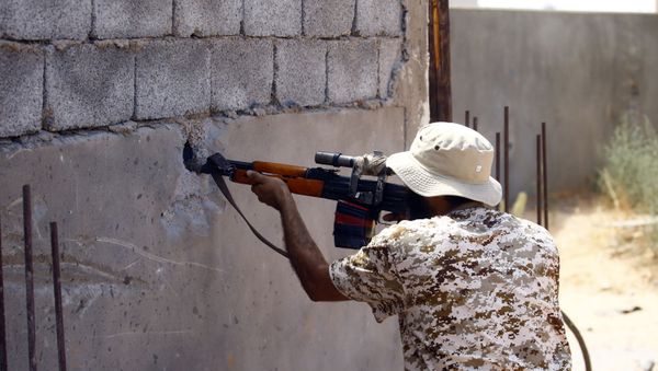A fighter loyal to the internationally recognised Libyan Government of National Accord (GNA) in the capital Tripoli's suburb of Ain Zara - Sputnik International