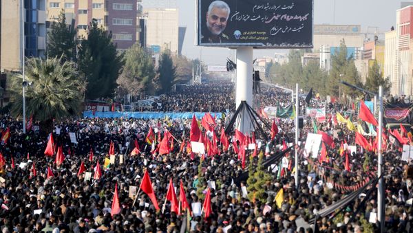 Iranian people attend a funeral procession and burial for Iranian Major-General Qassem Soleimani, head of the elite Quds Force, who was killed in an airstrike at Baghdad airport, at his hometown in Kerman, Iran January 7, 2020 - Sputnik International