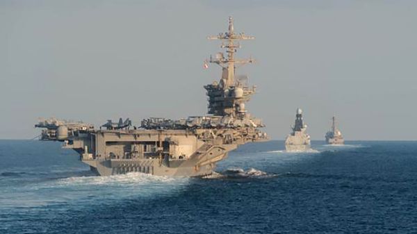 In this Tuesday, Nov. 19, 2019, photo made available by U.S. Navy, the aircraft carrier USS Abraham Lincoln, left, the air-defense destroyer HMS Defender and the guided-missile destroyer USS Farragut transit the Strait of Hormuz with the guided-missile cruiser USS Leyte Gulf. In this Tuesday, Nov. 19, 2019, photo made available by U.S. Navy, the aircraft carrier USS Abraham Lincoln, left, the air-defense destroyer HMS Defender and the guided-missile destroyer USS Farragut transit the Strait of Hormuz with the guided-missile cruiser USS Leyte Gulf. - Sputnik International